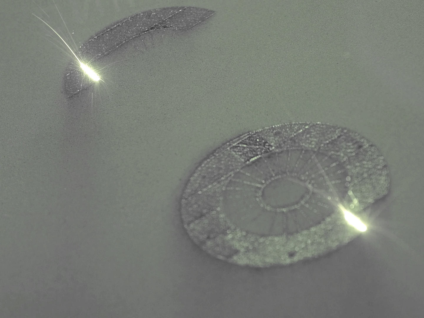 Dual laser additive manufacturing